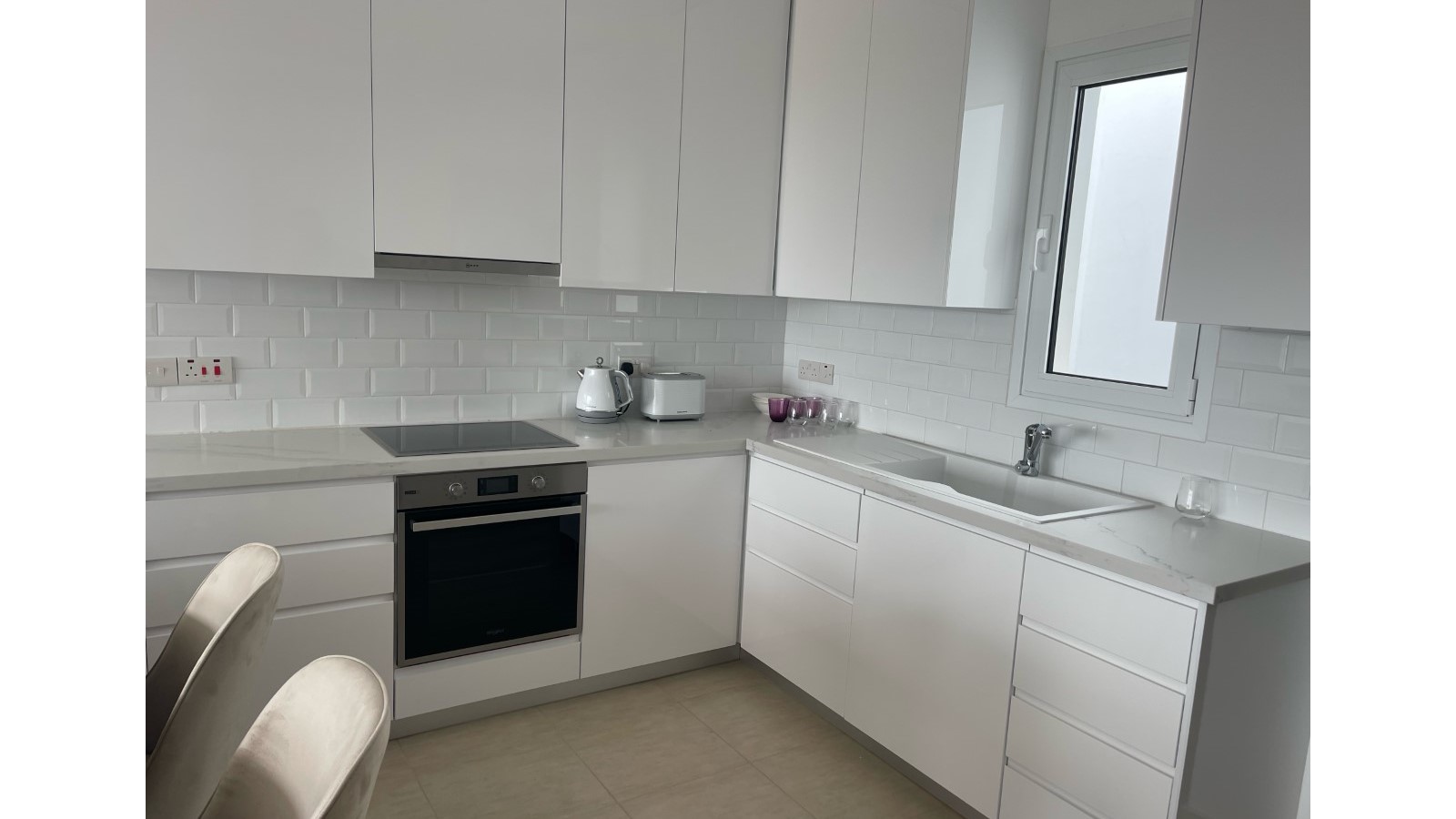 Modern White Kitchen at CBA Residences, Mesa Chorio, Cyprus
